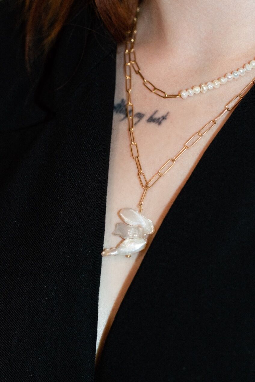 Layered chain and pearl necklaces with baroque pearl pendant