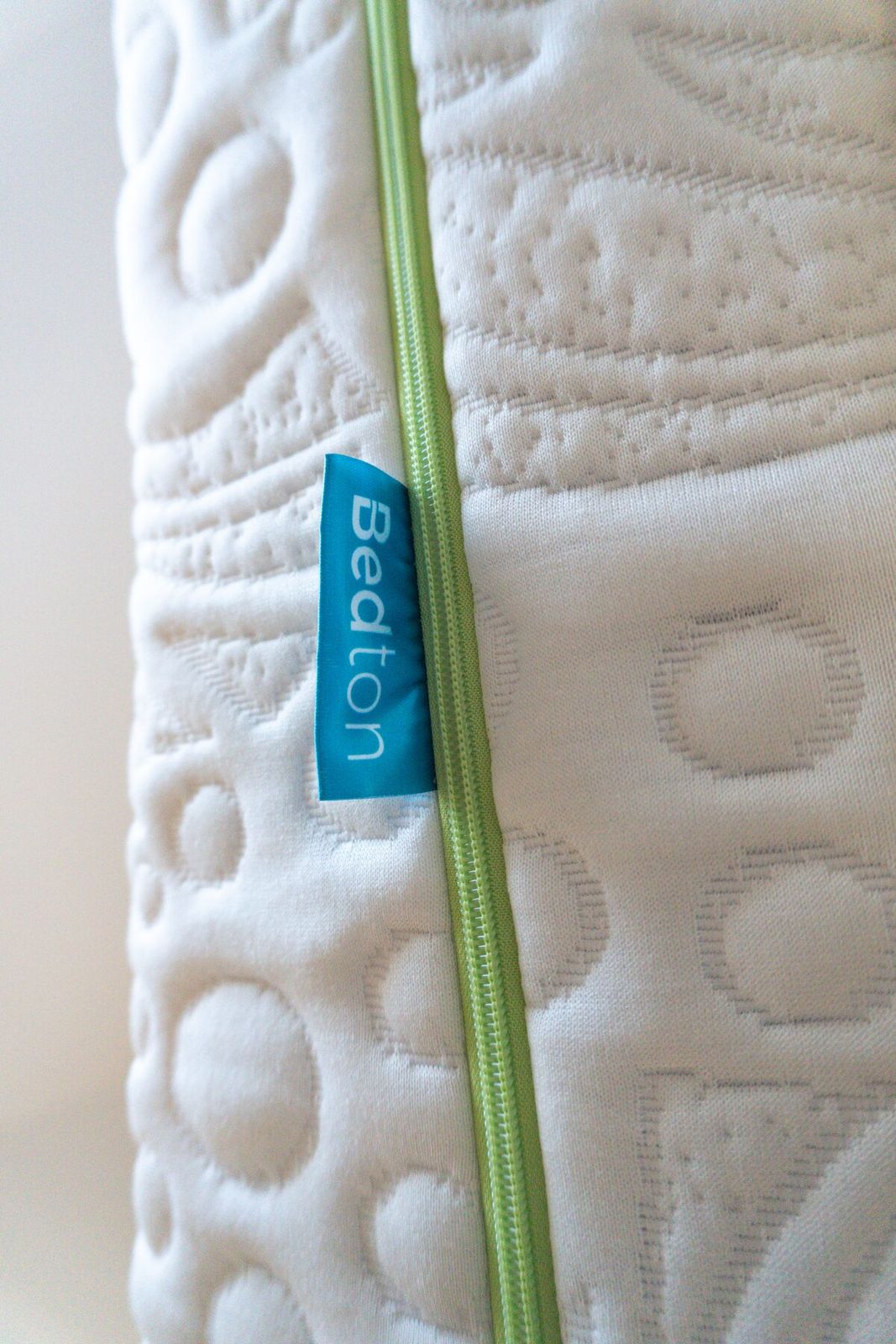 Bedton brand label and green zipper closeup