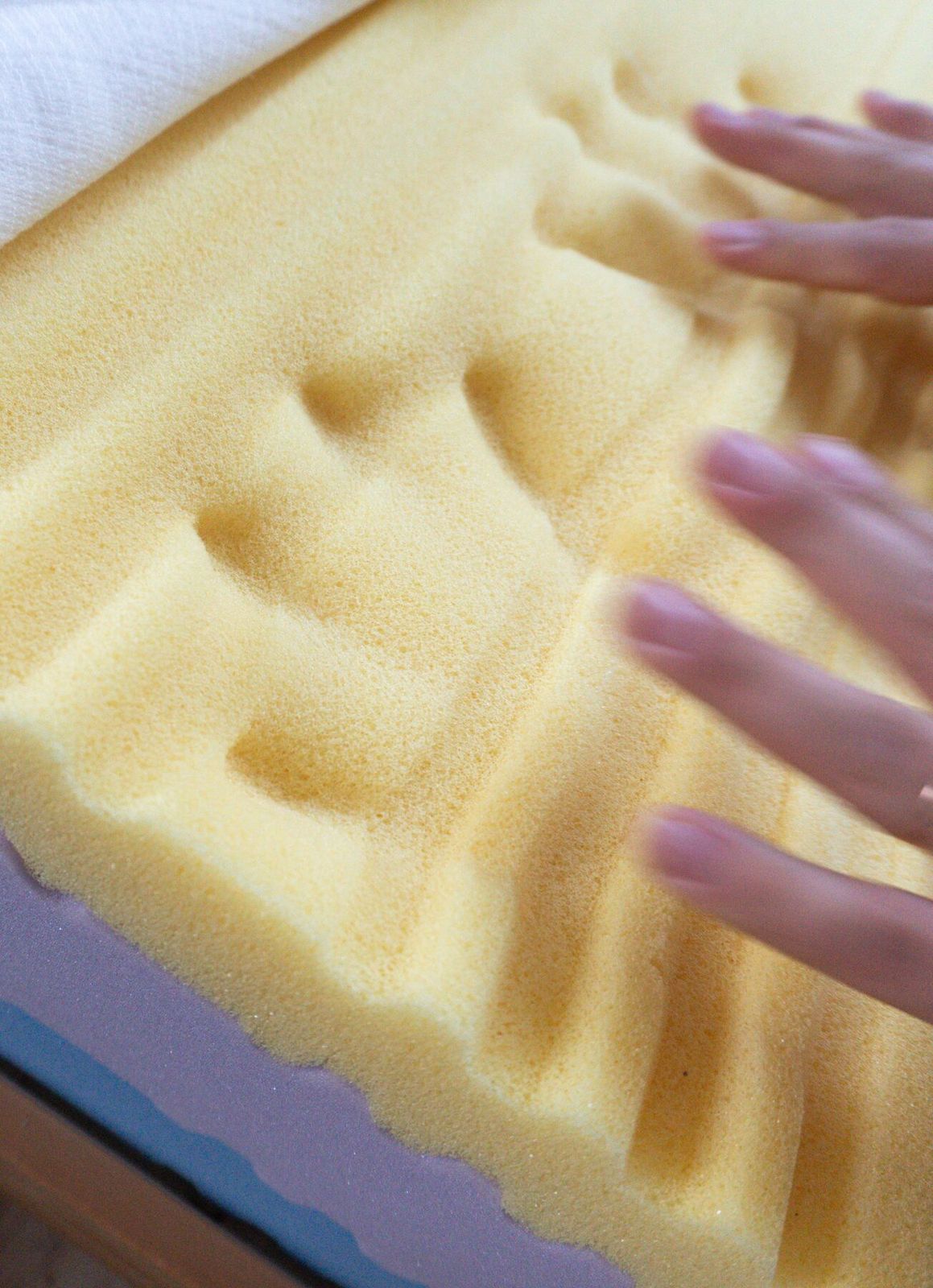 Hand impression in yellow foam top layer